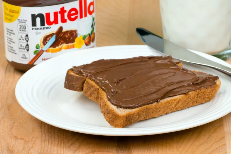 Jar of Nutella with toast and milk