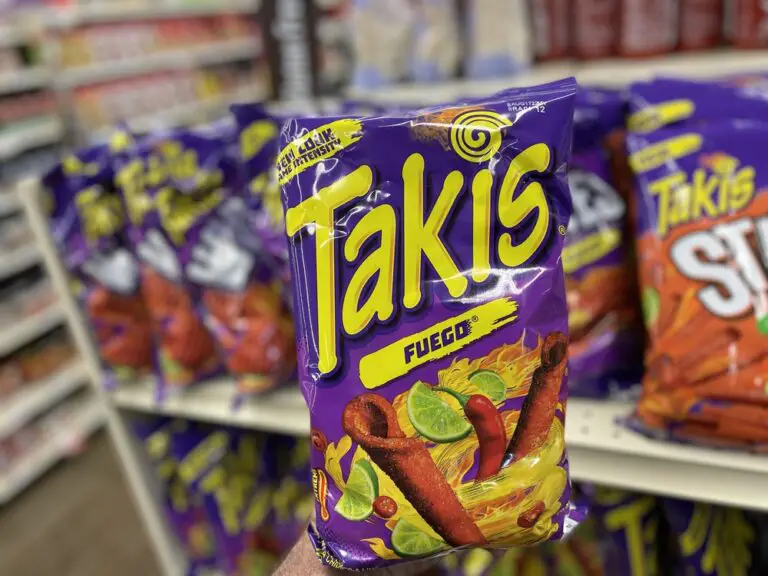 Retail store hand golding bag of Takis