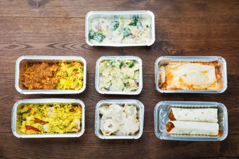 Tasty Meals In Foil Containers On The Table