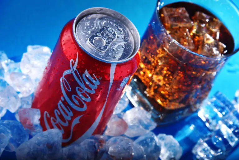 Can and glass of Coca-Cola with ice
