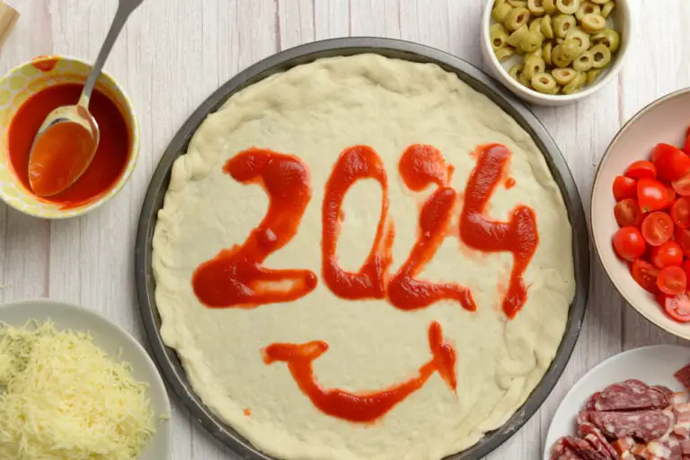 2024 written in tomato paste on a pizza, adding a flavorful twist to the New Year celebration